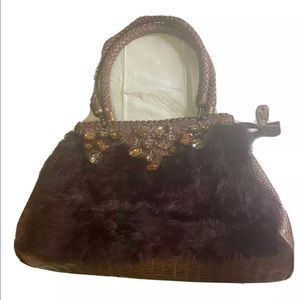 Large brown bag with Rhine stones on it.